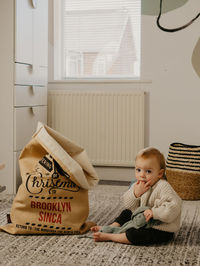 Portrait of cute girl using digital tablet at home