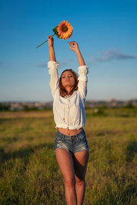 Full length of woman standing on land