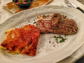 Close-up of meat with bread on plate