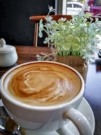 Close-up of cappuccino served on table