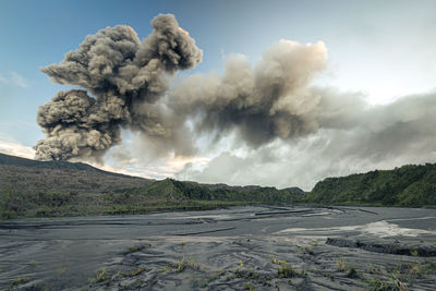 Scenic view of volcanic mountain against sky