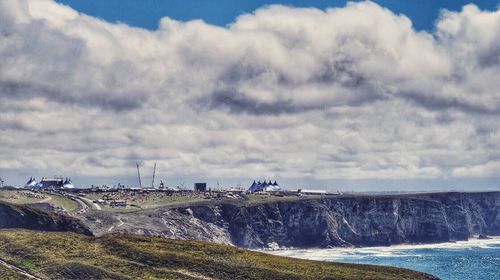 Scenic view of sea against cloudy sky