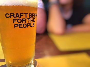 Close-up of beer glass on table