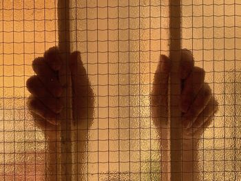 Shadow of man standing on wall