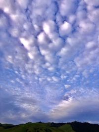 Low angle view of clouds over blue sky