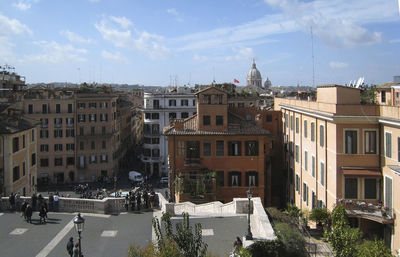 Buildings in city against sky