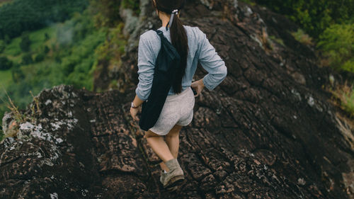 Full length of woman walking on rock