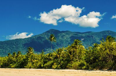 Scenic view of mountains against blue sky