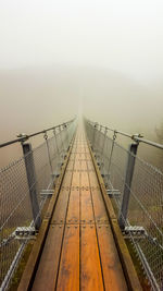 View of suspension bridge in foggy weather