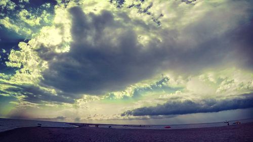 Scenic view of sea against cloudy sky