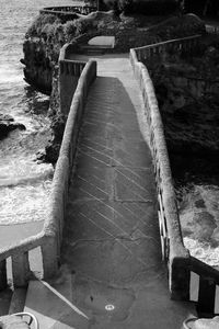 High angle view of old stone bridge over beach