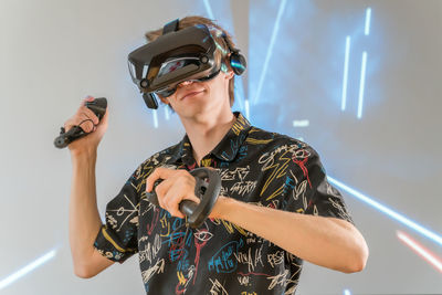 Rear view of man standing against wall