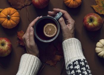 Directly above shot of woman holding drink