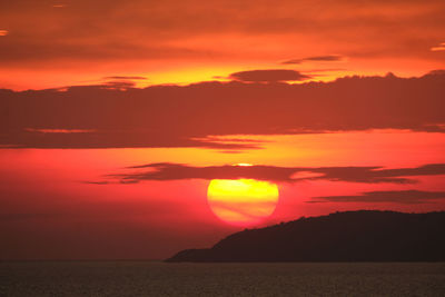 Scenic view of sea against romantic sky at sunset