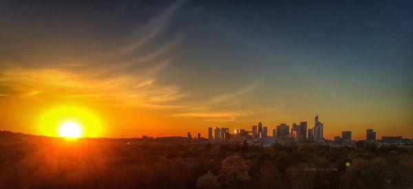 Cityscape against sky during sunset