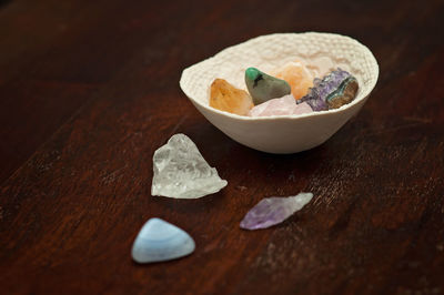 High angle view of stones in bowl on table
