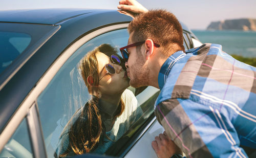 Portrait of men on car