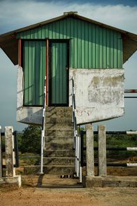 Low angle view of abandoned house against sky