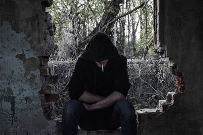 Man sitting in a forest