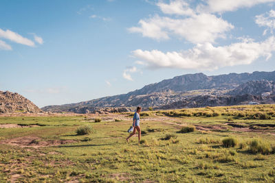 Full length of man on field against sky