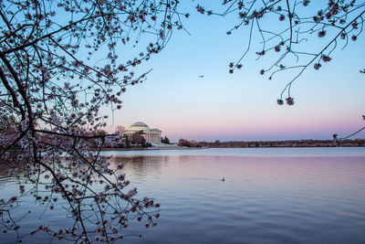 Scenic view of lake against sky during sunset