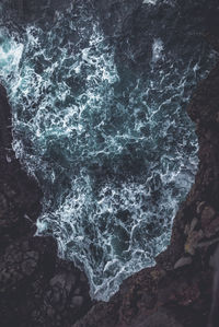 High angle view of rocks in sea