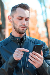Young man using mobile phone