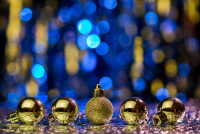 Close-up of christmas baubles on table