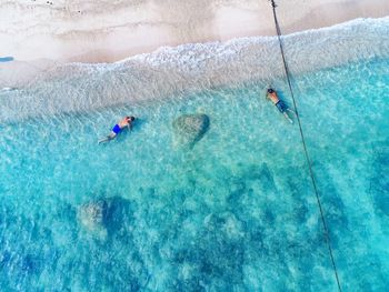 High angle view of people swimming in pool