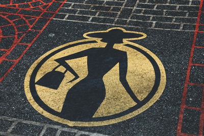 High angle view of bicycle sign on street