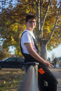 Young man sitting in park