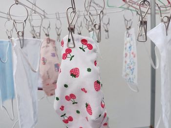 Close-up of clothes hanging on clothesline