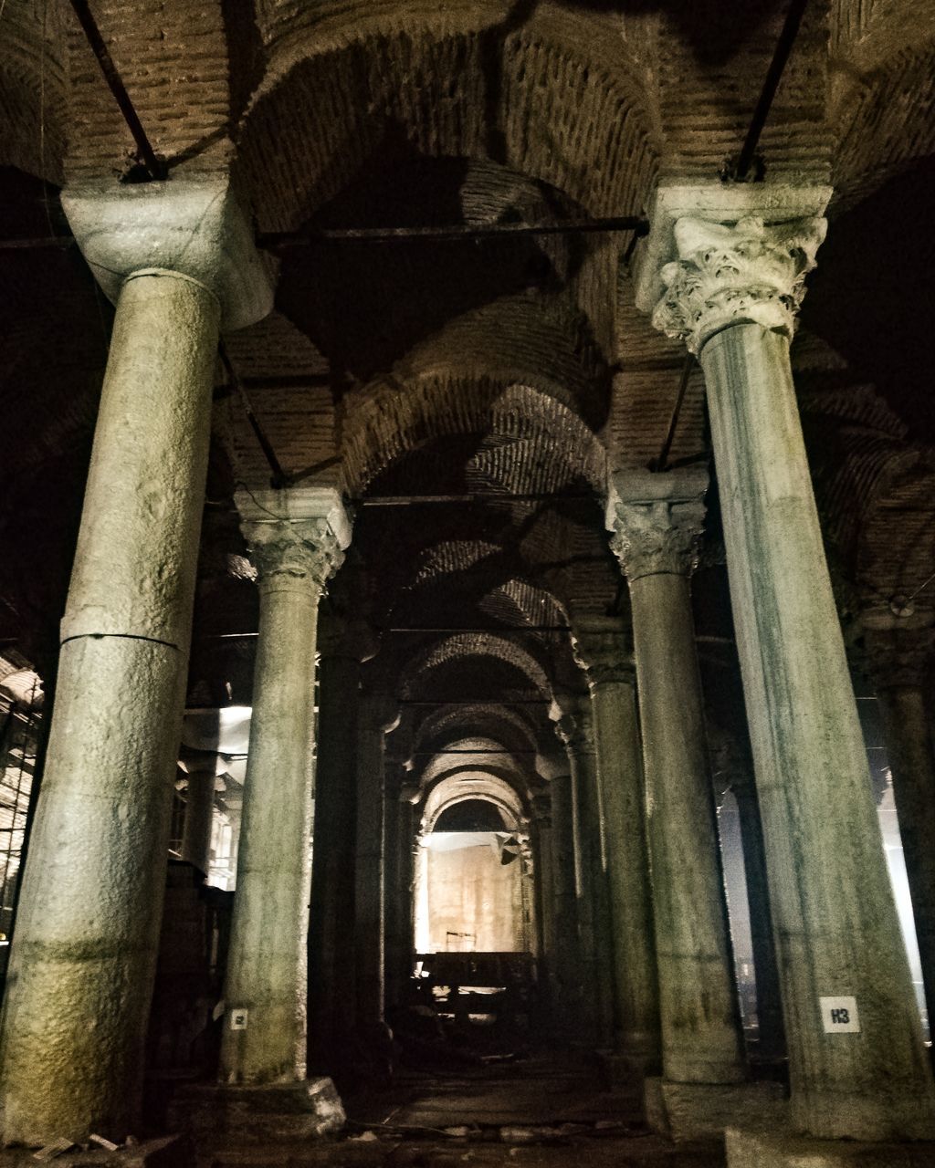 LOW ANGLE VIEW OF COLUMNS IN OLD BUILDING