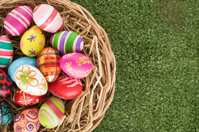 High angle view of multi colored eggs in basket