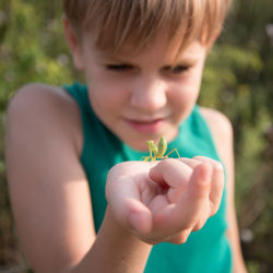 Close-up of boy holding hands