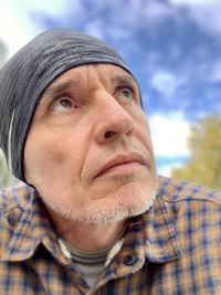 Close-up portrait of man wearing hat