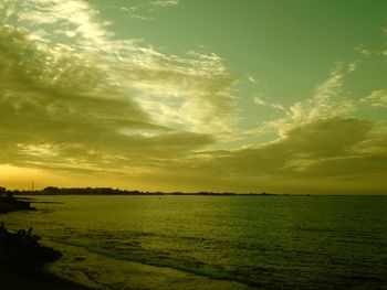 Scenic view of field against sky during sunset