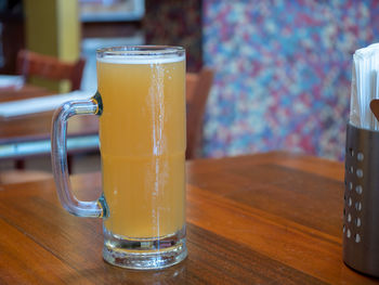 Close-up of beer glass on table