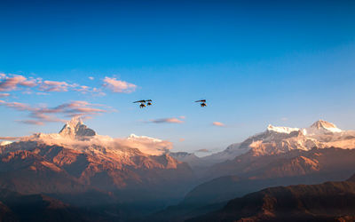 Flying ultralight aircraft over the mount annapurna rang at pokhara, nepal