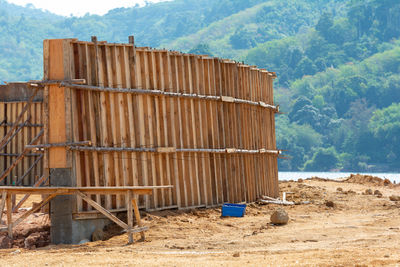 Fence on ground against mountain