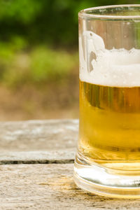 Close-up of beer glass on table