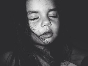 Close-up of woman with eyes closed