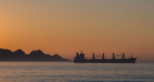 Silhouette of ship in sea