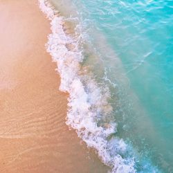 High angle view of waves on beach