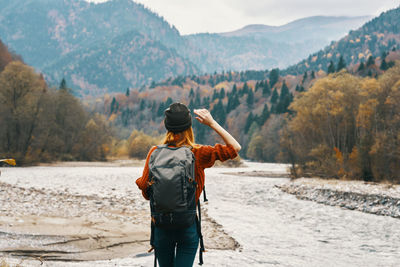 Rear view of man looking at mountains