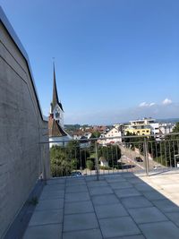 Buildings against clear blue sky