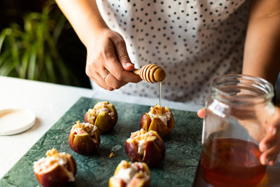 Midsection of woman preparing food