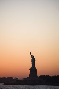 Statue of liberty, new york city at sunset