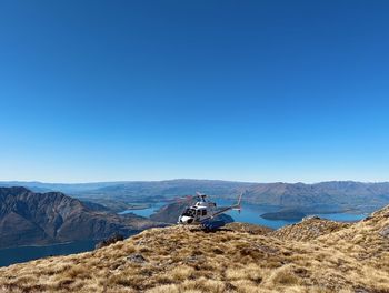 Scenic view of mountains against clear blue sky