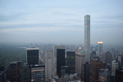 Cityscape against cloudy sky